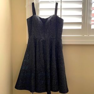 This is a Sherri Hill dress, size 12. It is formal dress, and comes with a mask.